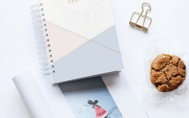 Photo of books, cookie and a paper clip