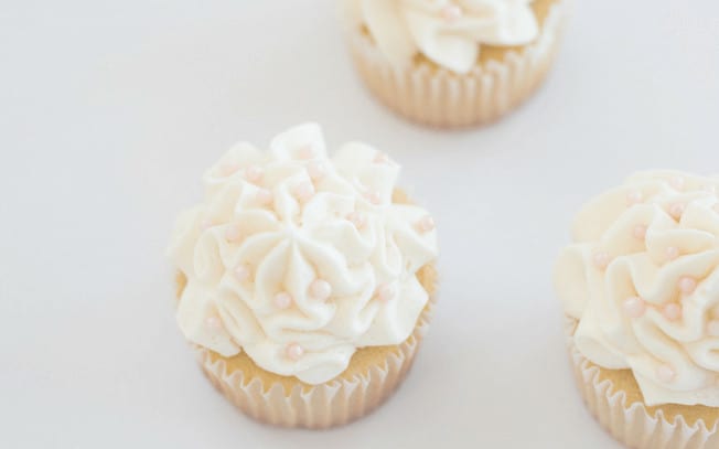 Two cupcakes with white icing