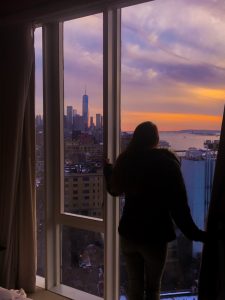 Girl standing in front of skyline