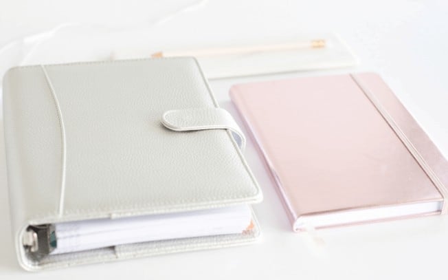 Grey and pink notebook side by side