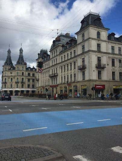 European building with a blue crosswalk