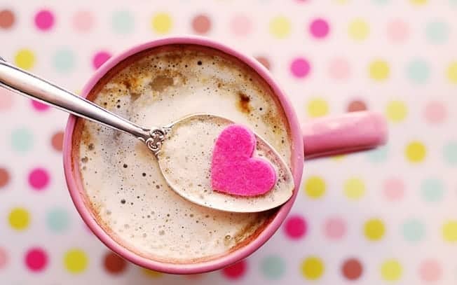 Hot chocolate with a spoon and a heart on the spoon