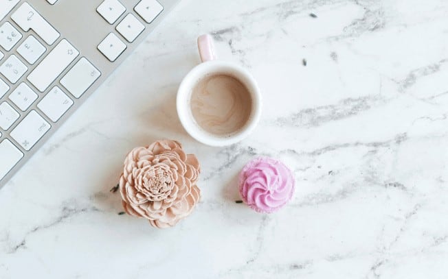 coffee and cupcakes on a marble desk