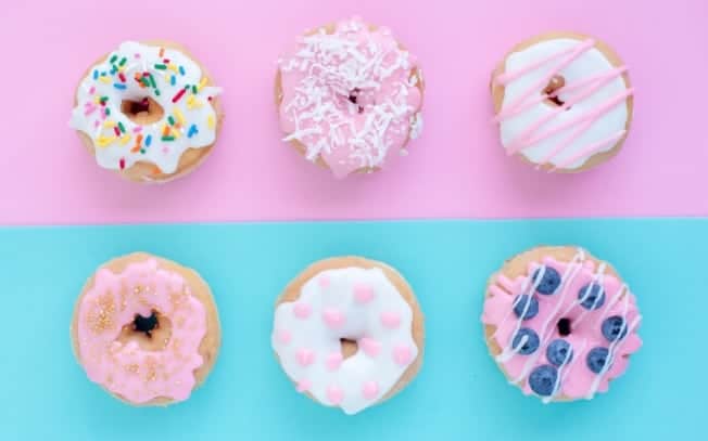 6 donuts on a pink and blue background