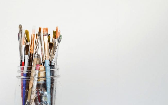 Paintbrushes in a jar