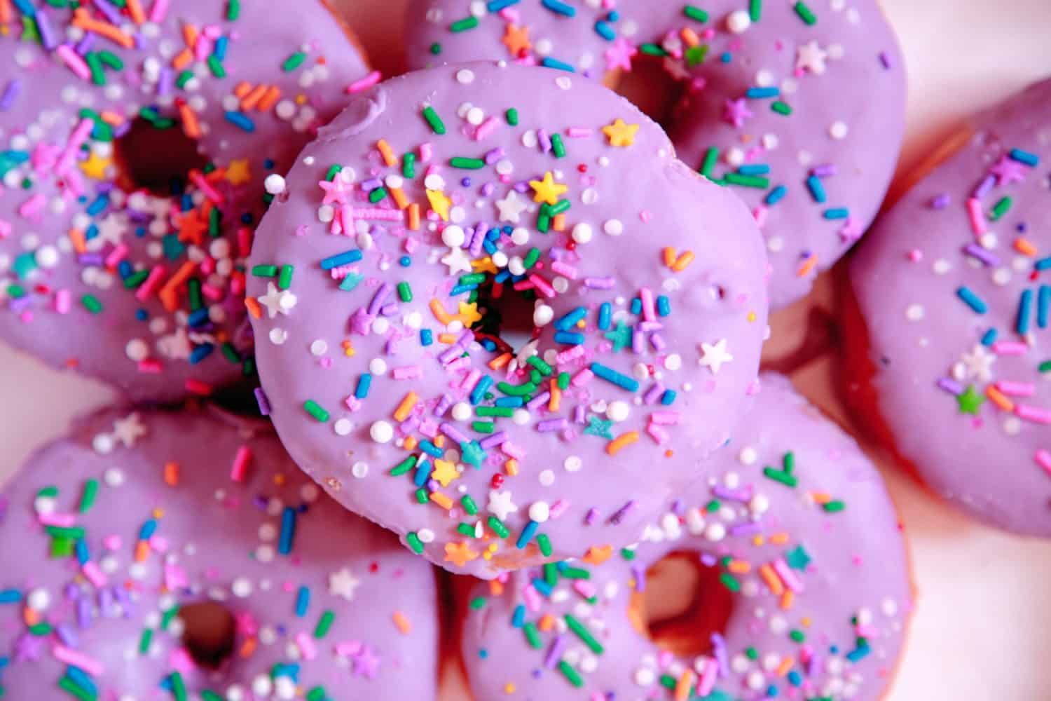 An ariel view of a stack of purple donuts.