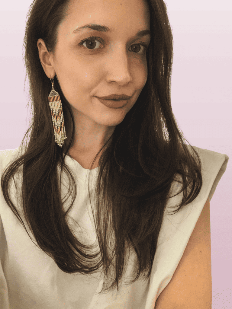 Headshot of a woman with long brown hair.