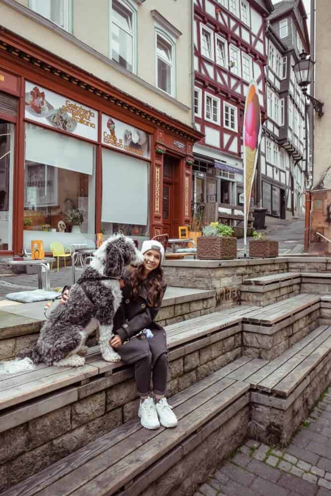 girl and dog sitting together