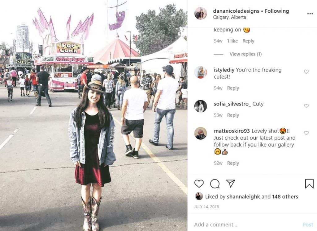 Screenshot of an Instagram image of a girl wearing a dress and a cowboy hat at an outdoor fair